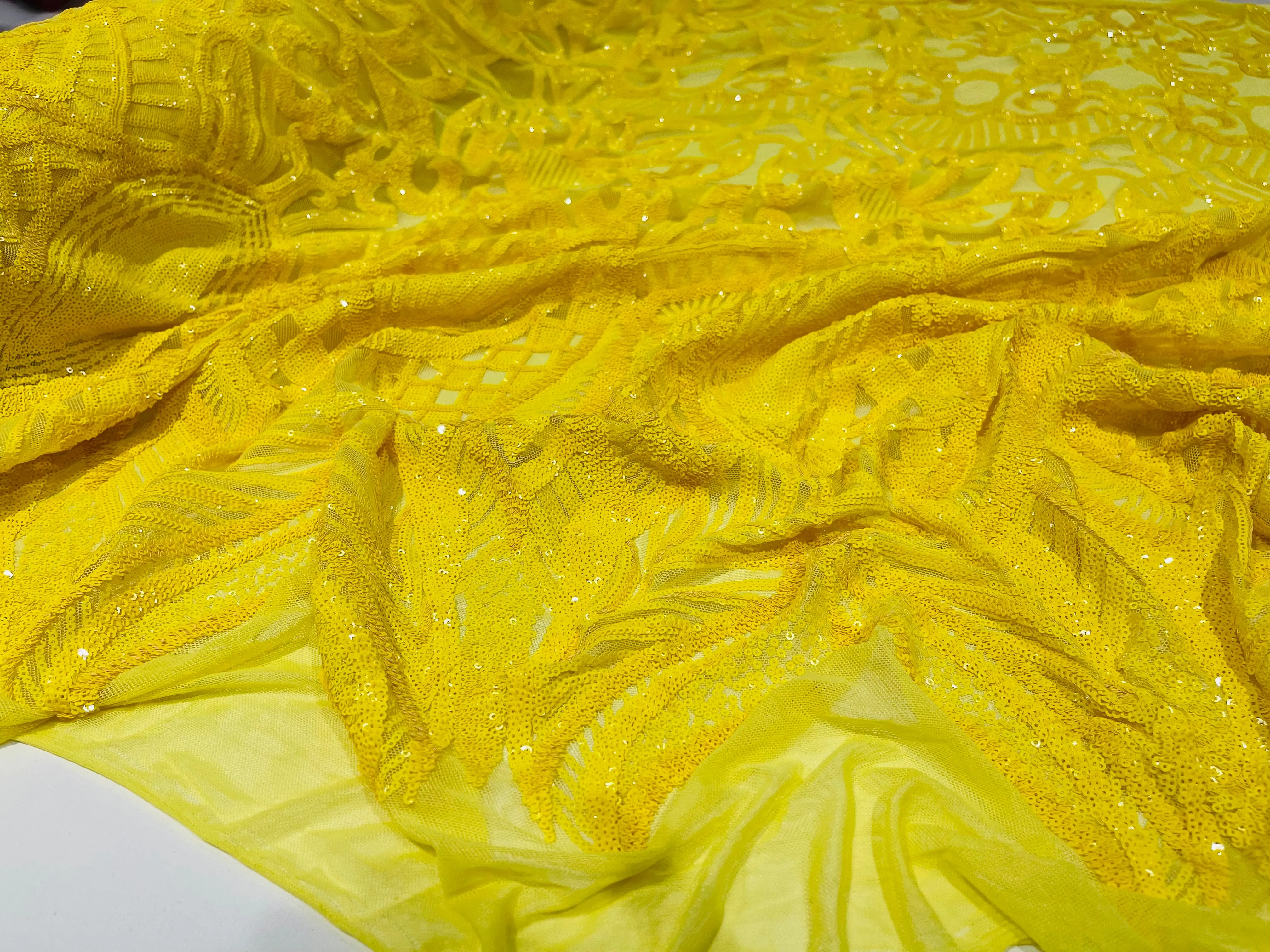 Bright Yellow royalty design on a 4 way stretch mesh-prom-sold by the yard.