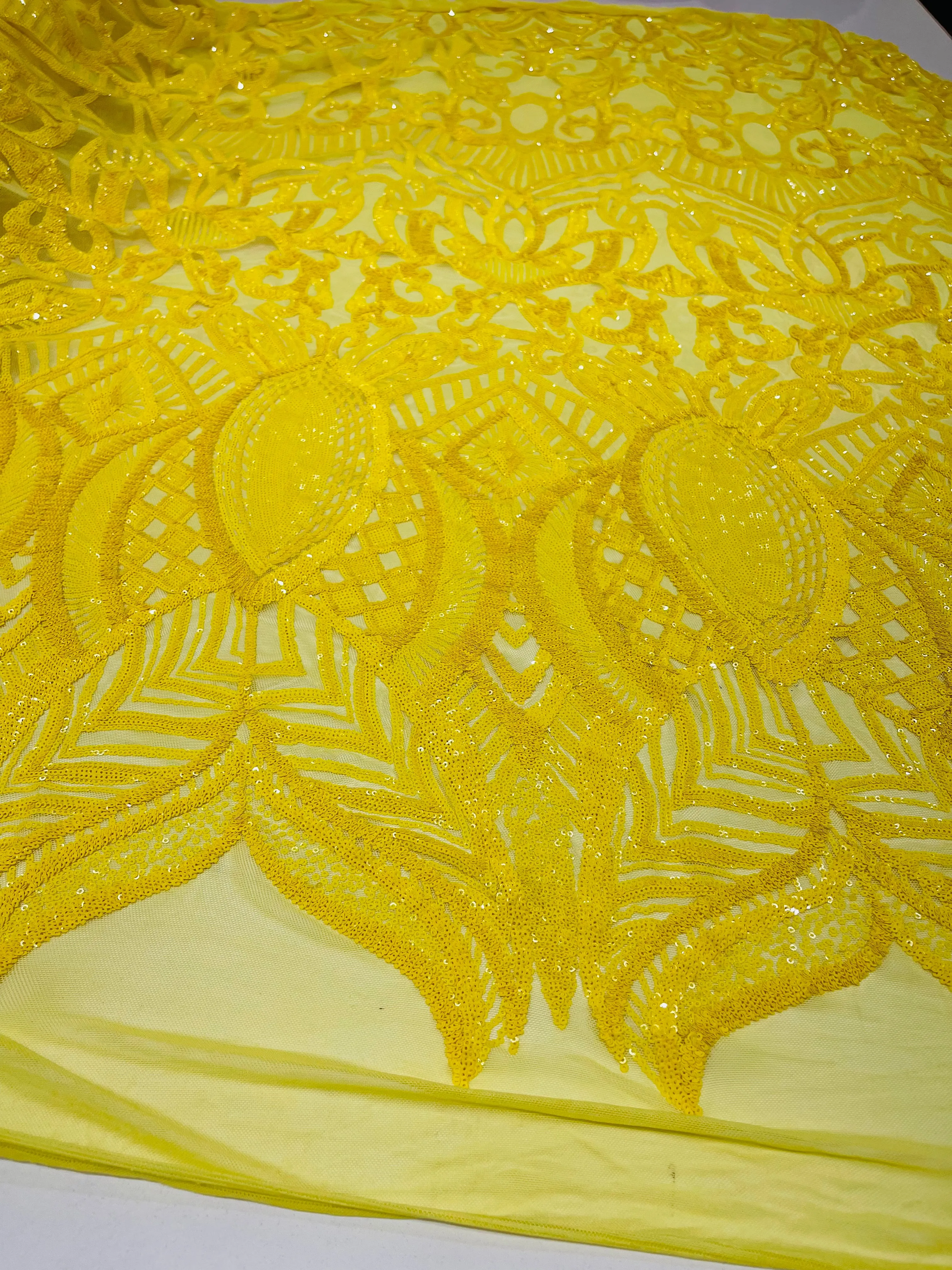 Bright Yellow royalty design on a 4 way stretch mesh-prom-sold by the yard.