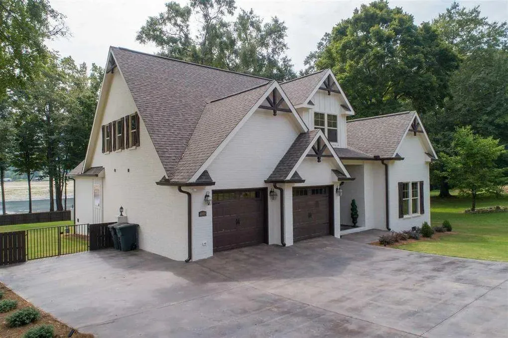 Spacious Family Home with Inviting Porches and Ample Garage Space