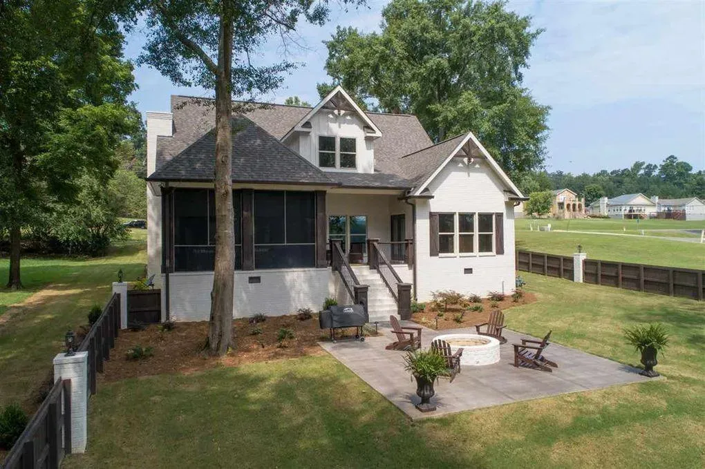 Spacious Family Home with Inviting Porches and Ample Garage Space